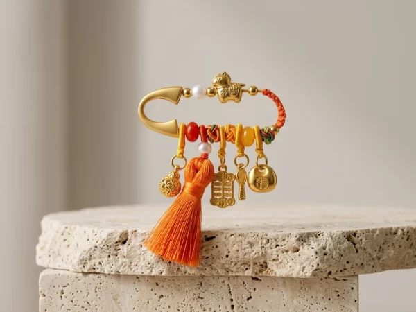 Orange good luck pin for wishes coming true.